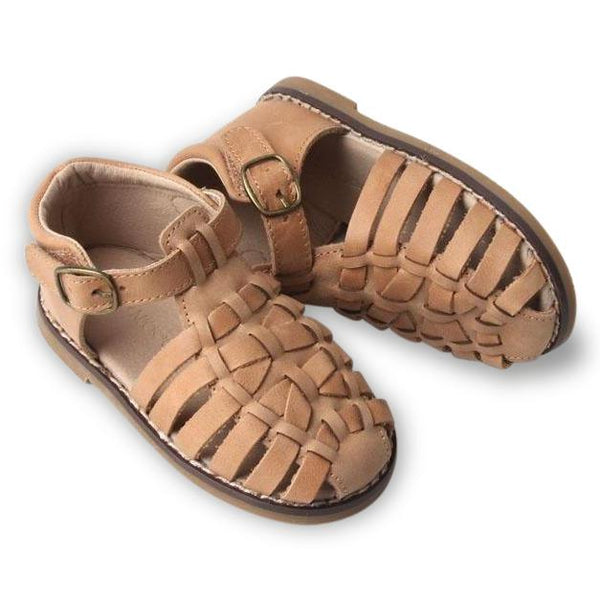 Introducing our newest sandal style! The "Indie Sandal". This beautiful closed toe sandal preserves traditional craftsmanship style, yet with a modern twist. Designed for boys and girls, it comes with a cushioned insole to ensure low impact, and a cushioned ankle support that will provide extra support to first time walkers.